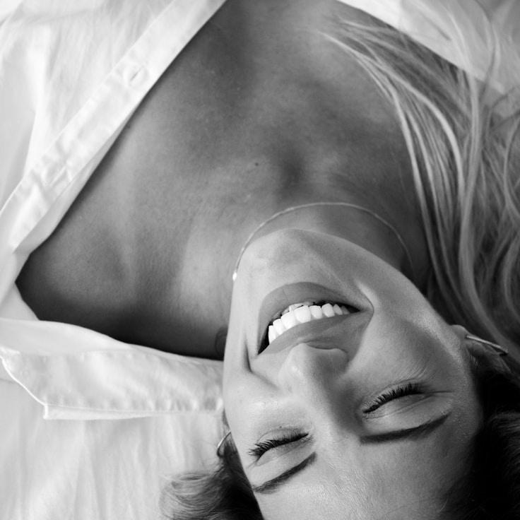 Alex Carter, Lead Design Curator at HarborStillPort, reviewing corporate floral arrangements